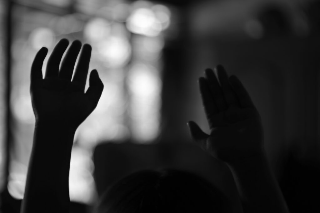Raised hands in praise at a new church plant
