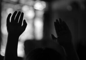 Raised hands in praise at a new church plant